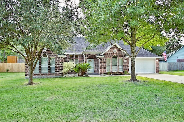 115 Texarkana Dr, Magnolia, TX 77354 - view of front of home with driveway, an attached garage, brick siding, and roof with shingles