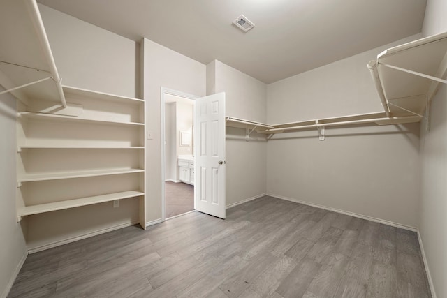 2507 Abernathy Glen Ct, Houston, TX 77014 - spacious closet featuring wood finished floors