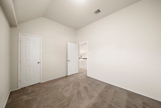 2507 Abernathy Glen Ct, Houston, TX 77014 - unfurnished bedroom with carpet floors and vaulted ceiling