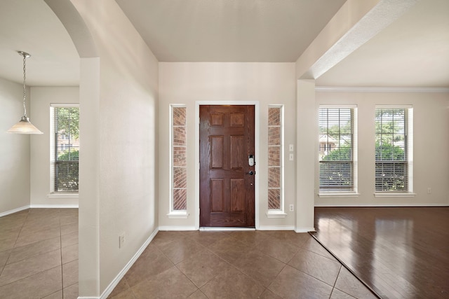 2507 Abernathy Glen Ct, Houston, TX 77014 - foyer featuring arched walkways, tile patterned flooring, and crown molding