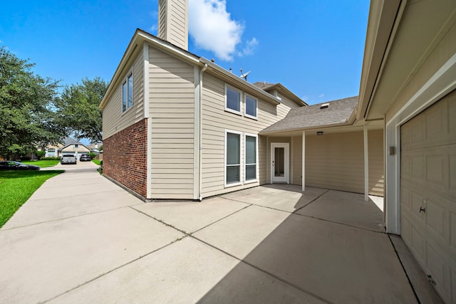 2507 Abernathy Glen Ct, Houston, TX 77014 - view of patio / terrace featuring a garage