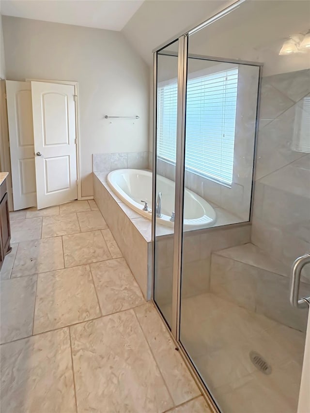3328 Primrose Canyon Ln, Pearland, TX 77584 - full bathroom featuring lofted ceiling, vanity, a bath, and a stall shower