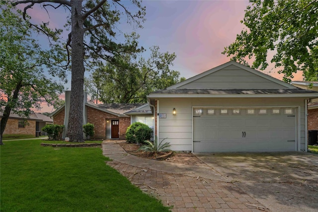 10503 Windriver Dr, Houston, TX 77070 - ranch-style home featuring a yard, driveway, and brick siding