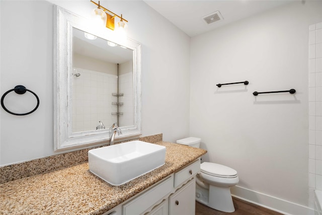 10503 Windriver Dr, Houston, TX 77070 - bathroom featuring vanity, toilet, and a shower