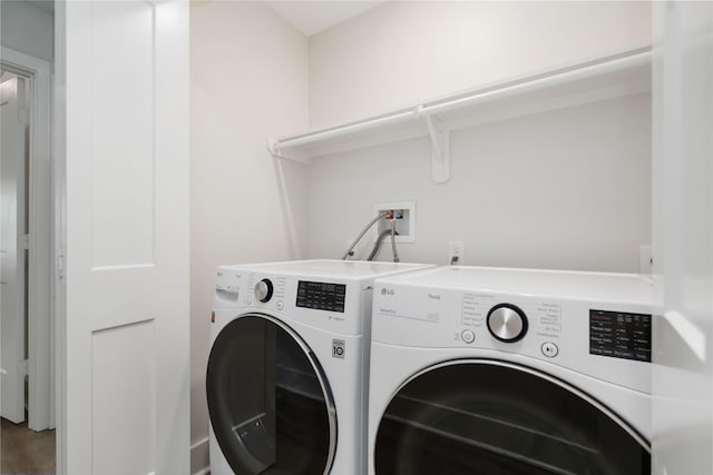 10503 Windriver Dr, Houston, TX 77070 - laundry room featuring washer and dryer