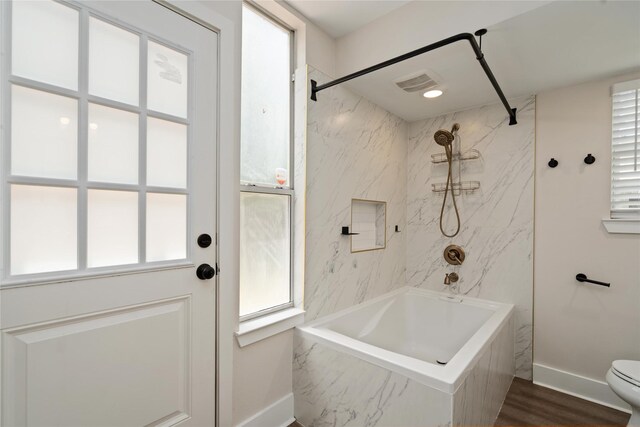 10503 Windriver Dr, Houston, TX 77070 - full bath featuring baseboards, a combined bath / shower with marble appearance, toilet, and wood finished floors