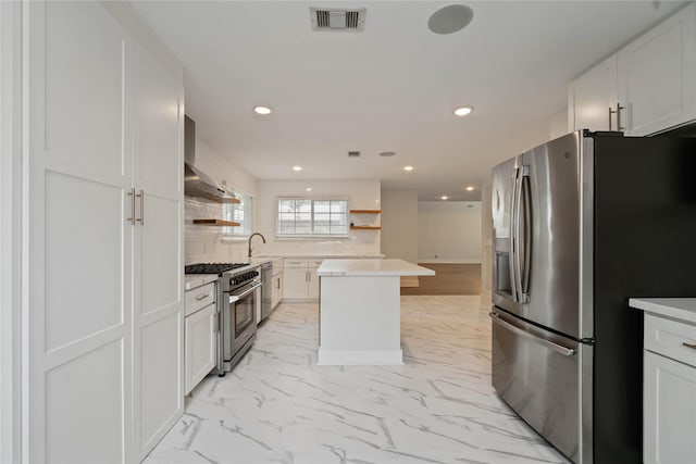 10503 Windriver Dr, Houston, TX 77070 - kitchen with stainless steel appliances, open shelves, recessed lighting, a kitchen island, and decorative backsplash