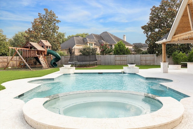 22111 Blacksburg Ct, Katy, TX 77450 - view of pool featuring a pool with connected hot tub, a playground, and a patio