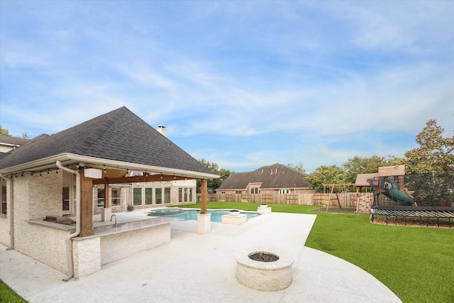 22111 Blacksburg Ct, Katy, TX 77450 - view of swimming pool with a patio area, a playground, area for grilling, a pool with connected hot tub, and an outdoor fire pit