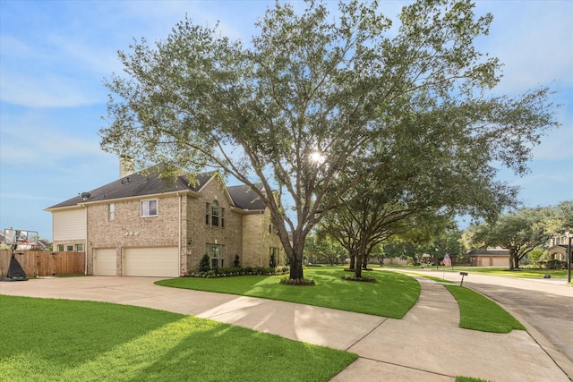 22111 Blacksburg Ct, Katy, TX 77450 - view of property exterior with a garage, brick siding, and driveway
