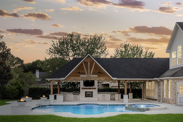 22111 Blacksburg Ct, Katy, TX 77450 - view of pool with a gazebo, an outdoor kitchen, a patio area, an outdoor fire pit, and exterior fireplace