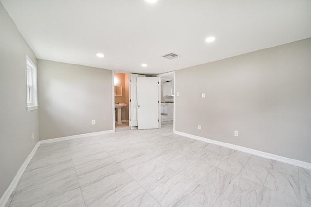 538 Pecan Dr, South Houston, TX 77587 - unfurnished bedroom with baseboards, recessed lighting, a sink, and ensuite bathroom