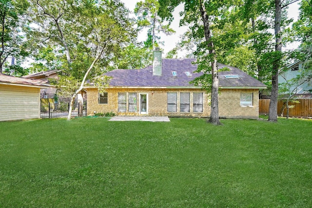 31 Silent Brook Pl, The Woodlands, TX 77381 - rear view of house with a chimney