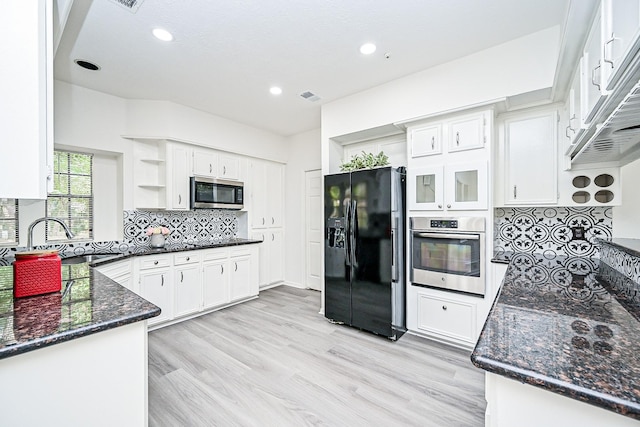 31 Silent Brook Pl, The Woodlands, TX 77381 - kitchen featuring appliances with stainless steel finishes, a sink, open shelves, dark stone countertops, and white cabinetry
