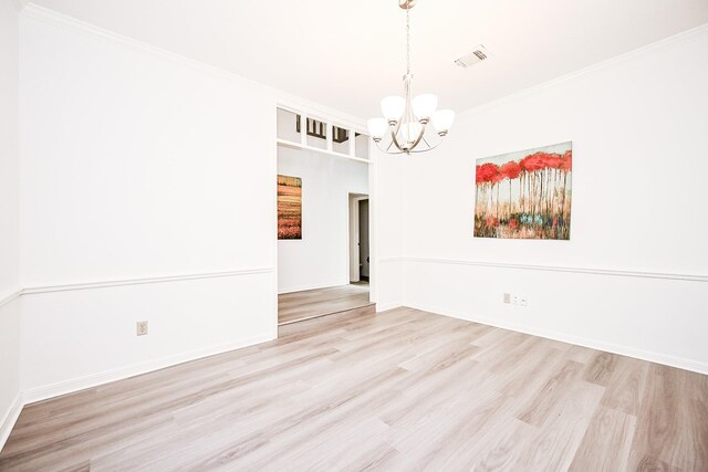 31 Silent Brook Pl, The Woodlands, TX 77381 - empty room with a chandelier, wood finished floors, crown molding, and baseboards