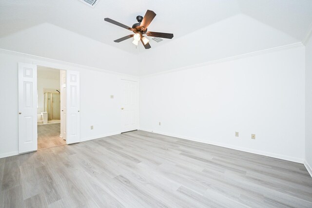 31 Silent Brook Pl, The Woodlands, TX 77381 - unfurnished bedroom featuring light wood finished floors, ensuite bathroom, vaulted ceiling, baseboards, and a ceiling fan