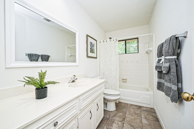 31 Silent Brook Pl, The Woodlands, TX 77381 - full bathroom featuring vanity, toilet, shower / tub combo, baseboards, and stone finish flooring