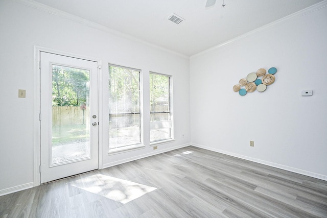 31 Silent Brook Pl, The Woodlands, TX 77381 - spare room featuring ornamental molding, wood finished floors, baseboards, and ceiling fan