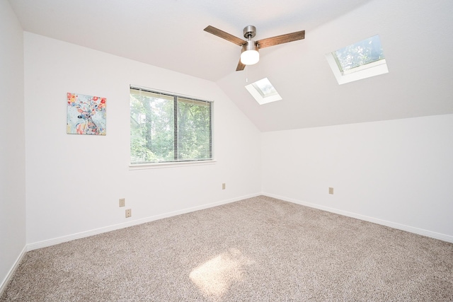 31 Silent Brook Pl, The Woodlands, TX 77381 - bonus room with a skylight, lofted ceiling, carpet floors, ceiling fan, and baseboards