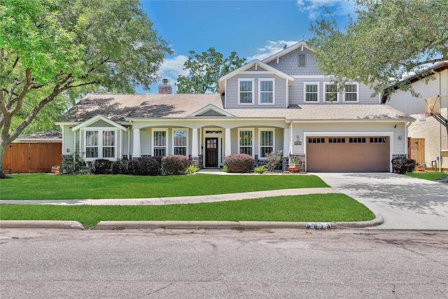 9614 Mariposa St, Houston, TX 77025 - craftsman-style house featuring concrete driveway, a garage, stone siding, and a chimney
