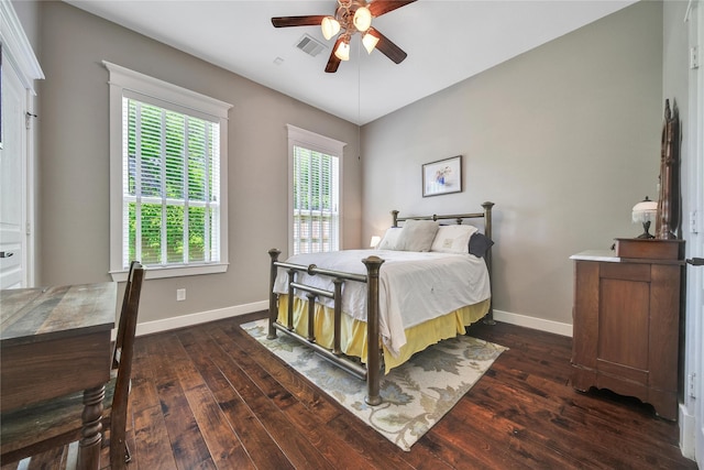 9614 Mariposa St, Houston, TX 77025 - bedroom with dark wood-style flooring, baseboards, and ceiling fan