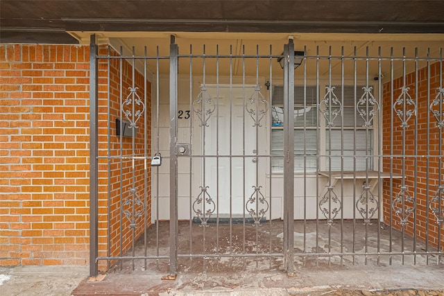 423 Gammon Dr, Houston, TX 77022 - entrance to property featuring brick siding and a gate