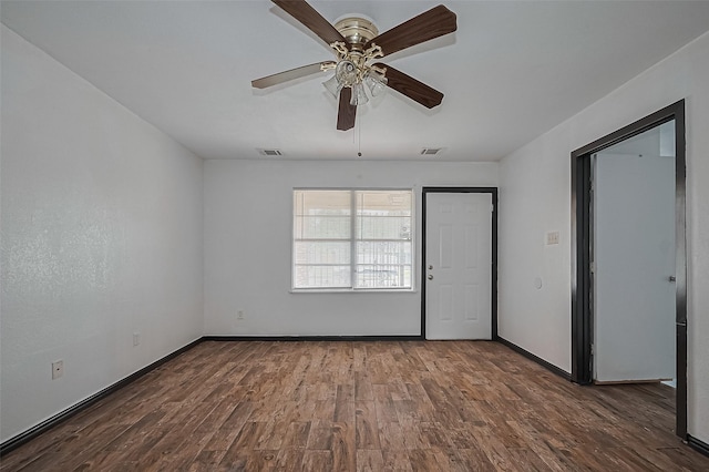 423 Gammon Dr, Houston, TX 77022 - unfurnished room with wood finished floors, ceiling fan, and baseboards