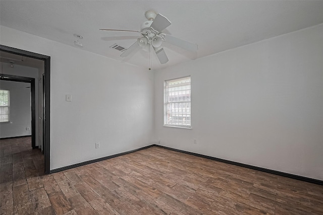423 Gammon Dr, Houston, TX 77022 - spare room featuring healthy amount of natural light, wood finished floors, ceiling fan, and baseboards