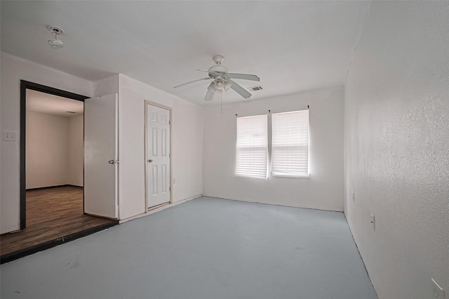 423 Gammon Dr, Houston, TX 77022 - unfurnished bedroom with a ceiling fan and concrete flooring