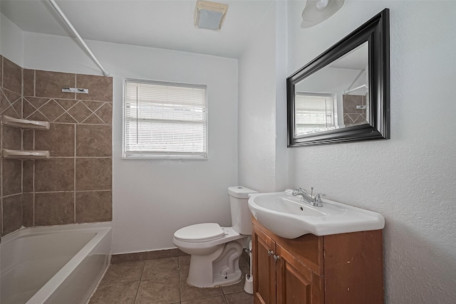 423 Gammon Dr, Houston, TX 77022 - bathroom with plenty of natural light, vanity, toilet, and tile patterned floors