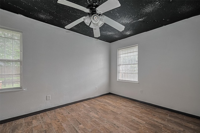 423 Gammon Dr, Houston, TX 77022 - empty room with plenty of natural light, wood finished floors, and a ceiling fan