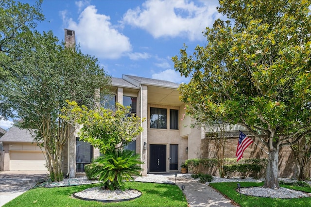 12007 Lakeway Ct, Houston, TX 77071 - view of front facade with brick siding, a garage, driveway, and a front lawn