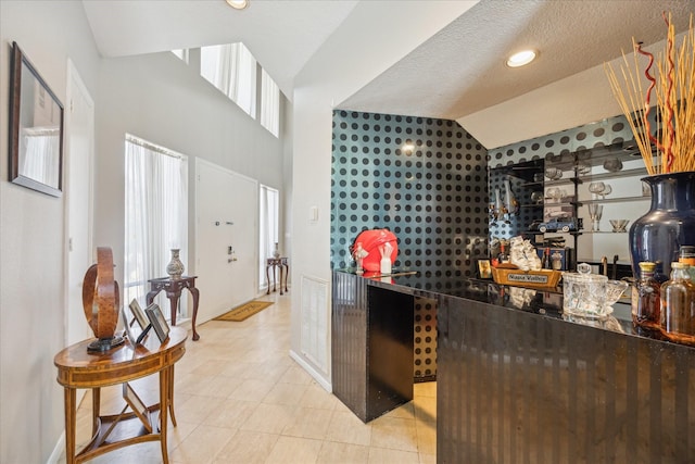 12007 Lakeway Ct, Houston, TX 77071 - reception featuring lofted ceiling and a bar