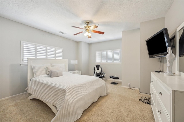 12007 Lakeway Ct, Houston, TX 77071 - bedroom featuring light colored carpet, a ceiling fan, and baseboards