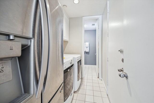 12007 Lakeway Ct, Houston, TX 77071 - laundry area with washer and clothes dryer and light tile patterned floors