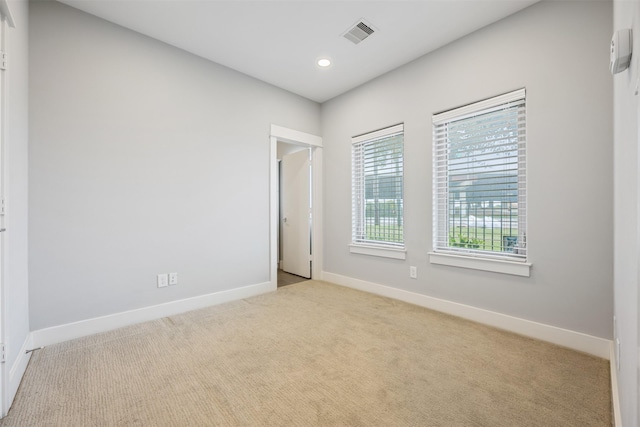 727 Schwartz St, Houston, TX 77020 - carpeted empty room featuring baseboards and recessed lighting