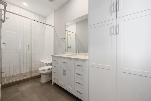 727 Schwartz St, Houston, TX 77020 - full bath with a shower stall, toilet, vanity, tile patterned floors, and recessed lighting