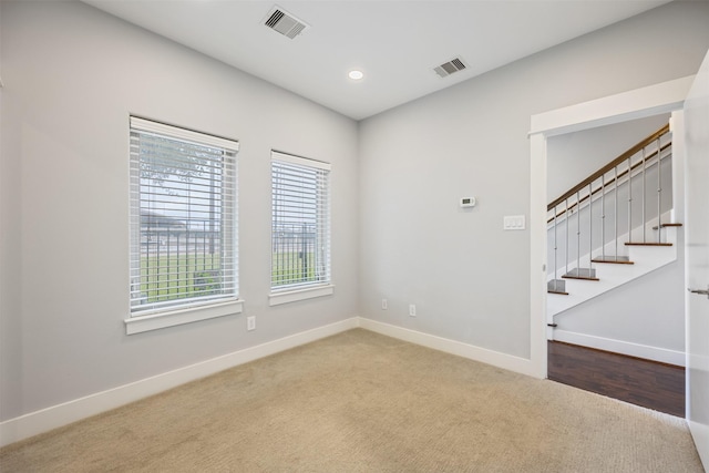 727 Schwartz St, Houston, TX 77020 - carpeted spare room with baseboards, recessed lighting, and stairs