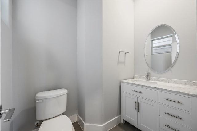 727 Schwartz St, Houston, TX 77020 - half bathroom featuring toilet, vanity, and baseboards