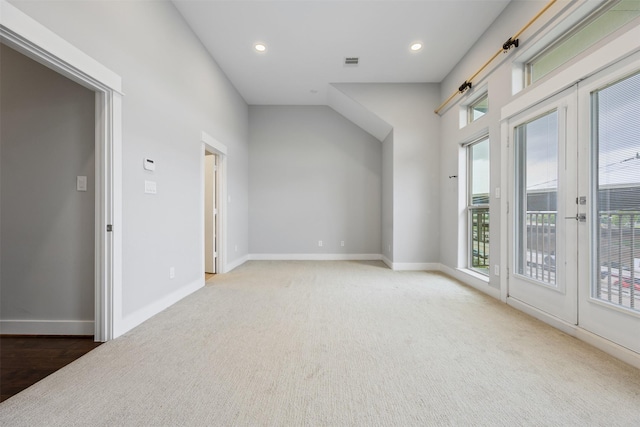 727 Schwartz St, Houston, TX 77020 - empty room featuring baseboards, recessed lighting, light colored carpet, and french doors