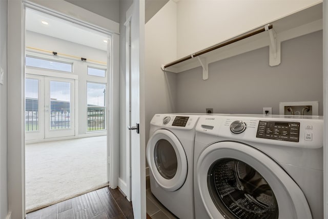 727 Schwartz St, Houston, TX 77020 - laundry area featuring washer and dryer, dark wood-type flooring, french doors, dark carpet, and baseboards