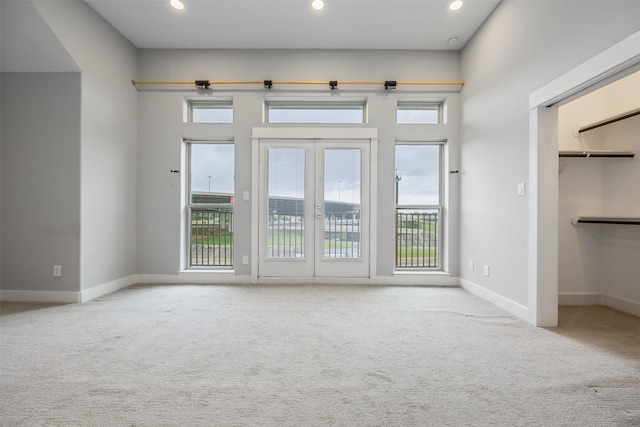 727 Schwartz St, Houston, TX 77020 - carpeted spare room featuring french doors, baseboards, and recessed lighting