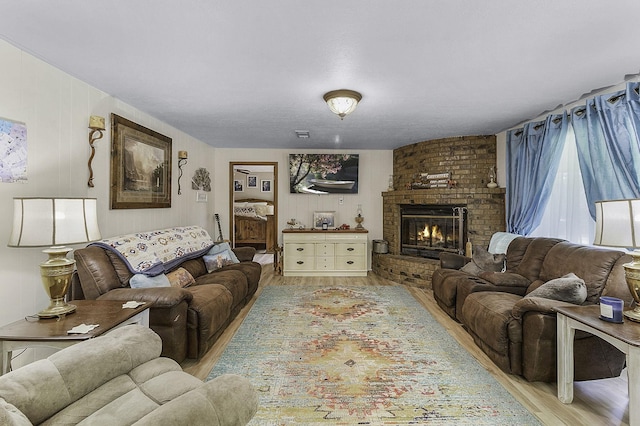 6462 US Highway 190 E, Livingston, TX 77351 - living room featuring wood finished floors and a fireplace