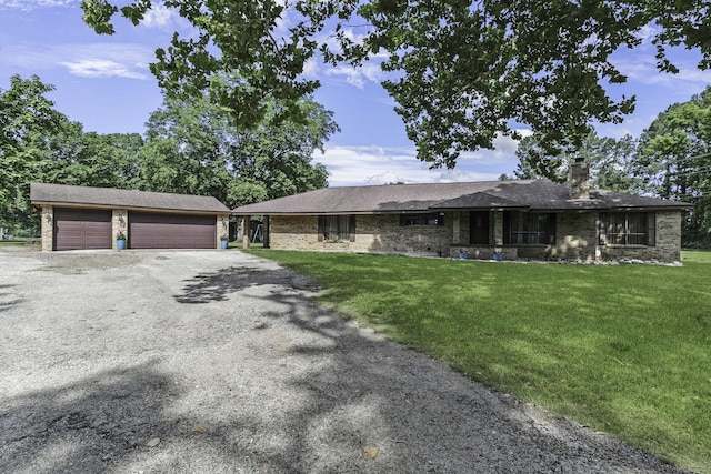 6462 US Highway 190 E, Livingston, TX 77351 - ranch-style home with a chimney, a front yard, and an outbuilding
