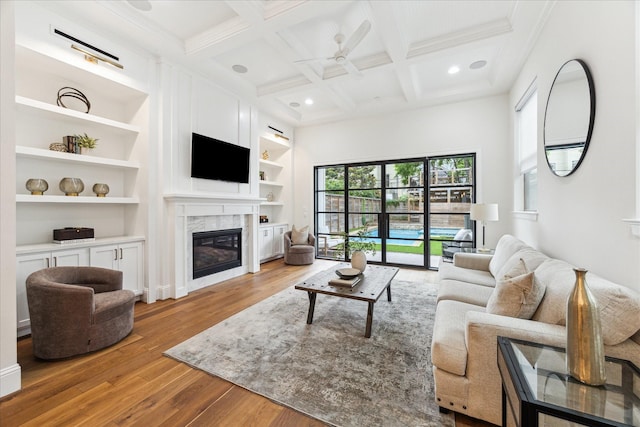 540 W 26th St Unit B, Houston, TX 77008 - living area featuring hardwood / wood-style flooring, beam ceiling, a glass covered fireplace, ceiling fan, and recessed lighting