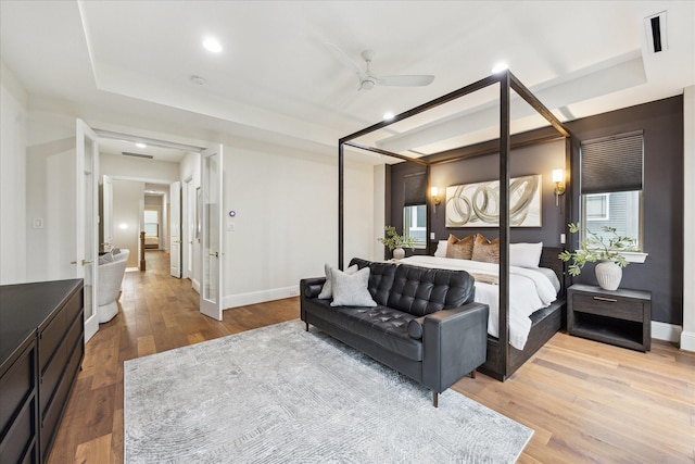 540 W 26th St Unit B, Houston, TX 77008 - bedroom featuring a raised ceiling, wood finished floors, baseboards, and recessed lighting