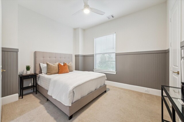 540 W 26th St Unit B, Houston, TX 77008 - bedroom with carpet flooring, wainscoting, and ceiling fan