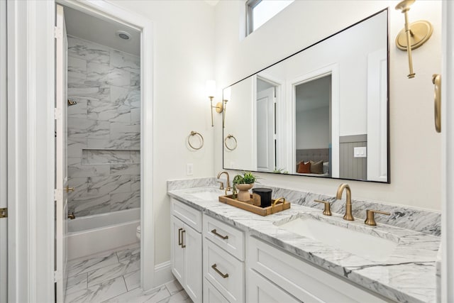 540 W 26th St Unit B, Houston, TX 77008 - bathroom with marble finish flooring, double vanity, toilet, tub / shower combination, and baseboards