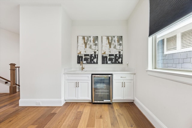 540 W 26th St Unit B, Houston, TX 77008 - indoor wet bar with beverage cooler, light wood finished floors, and baseboards