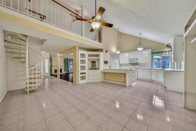 4214 Hambledon Village Dr, Houston, TX 77014 - kitchen with white appliances, light tile patterned flooring, high vaulted ceiling, light countertops, and a ceiling fan